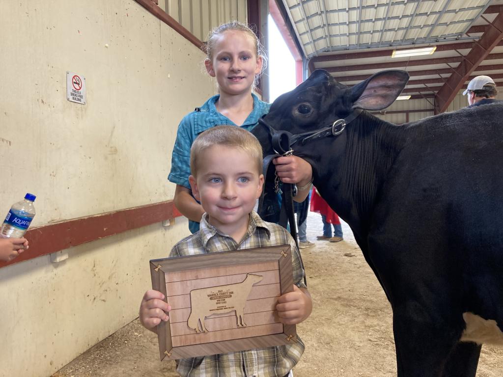 Jason Burmeister - Waupaca County Fair - Junior Champion of the Open Show awarded to Owen Burmeister. Hailey Burmeister is pictured behind.